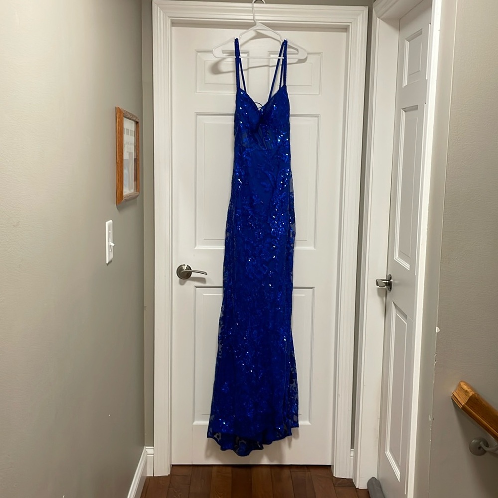 Blue open back prom dress. Size 16. Slit in leg.